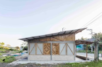 Diseño de pequeña casa de campo construida con bambú, concreto y ladrillo