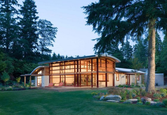 Diseño de casa de campo de un piso con techo a doble altura