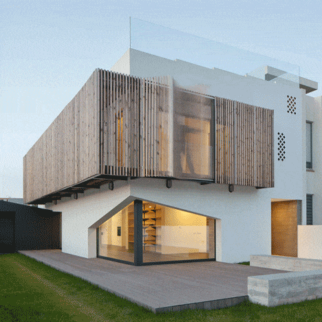 Diseño de casa dos pisos con fachada de persianas plegables