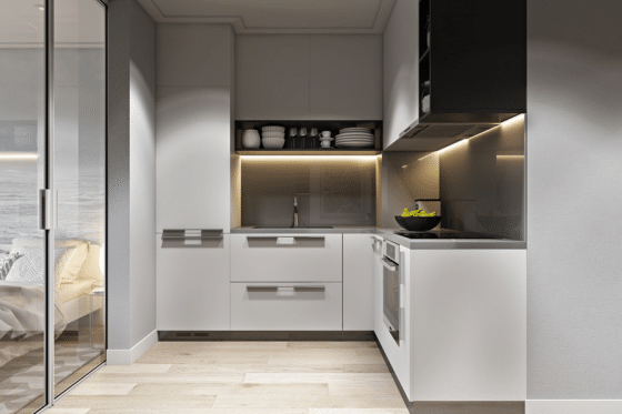Pequeña cocina en forma de L y azulejos color gris